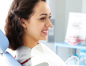 Smiling woman in dental chair