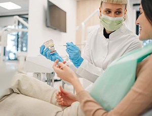 Young female listening to dentist