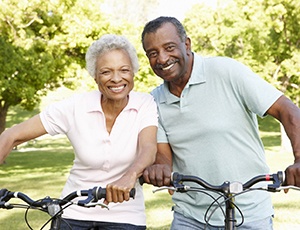 Couple smiling with dental bridge in Carrollton