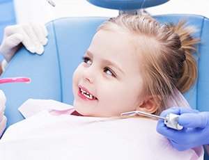 Little girl receiving dental exam