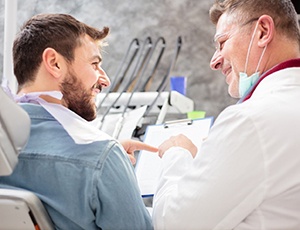 Happy man sitting upright in dental treatment chair