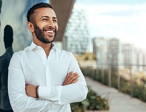 man smiling with dental crowns in Carrollton