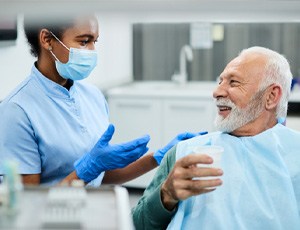 man asking about tooth replacement options  
