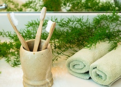 Toothbrushes in clay cup