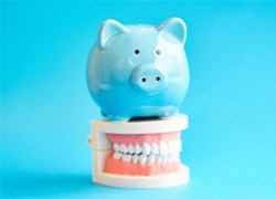 piggy bank representing cost of dentures in Carrollton