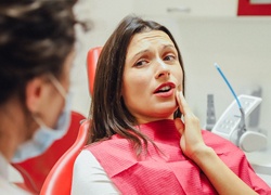 Woman at dentist for dental emergency in Carrollton