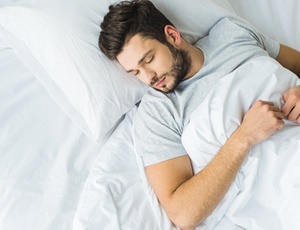 Man resting in bed