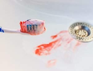 a toothbrush with blood on it