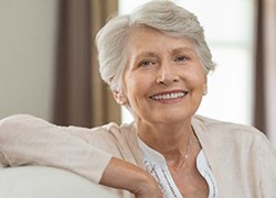 elderly woman sitting on a couch