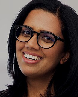 Young woman with glasses smiling