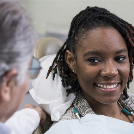 taking a dental xray of a patient