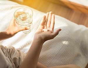 Woman taking a pill