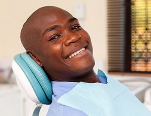 Smiling man in dental chair