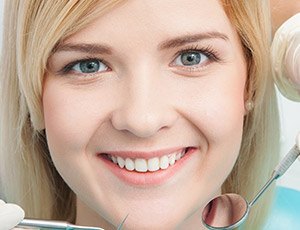 Woman receiving dental exam