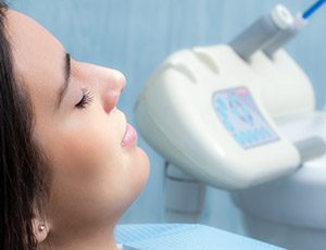 Woman with eyes closed in dental chair