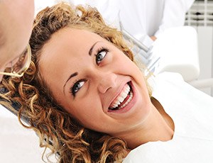 Smiling woman in dental chair