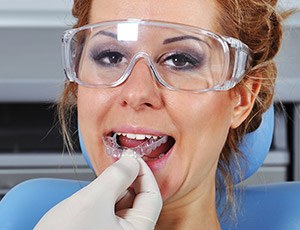 Woman having oral appliance fitted