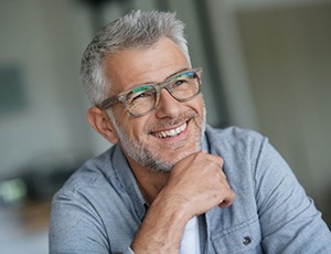 older man smiling after teeth whitening in Carrollton 