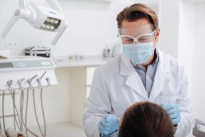 Dentist in Carrollton using PPE