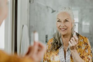 woman smiling in mirror