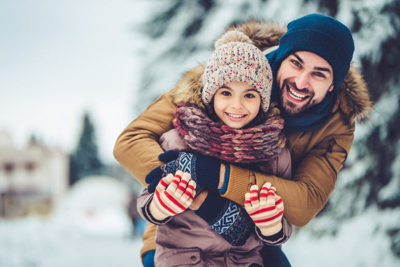 a family smiling with good oral health in Carrollton